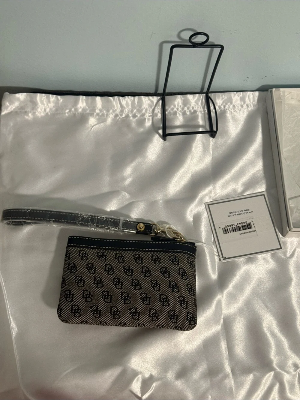 Dooney and Bourke NWT Medium logo wristlet. Comes in a box!